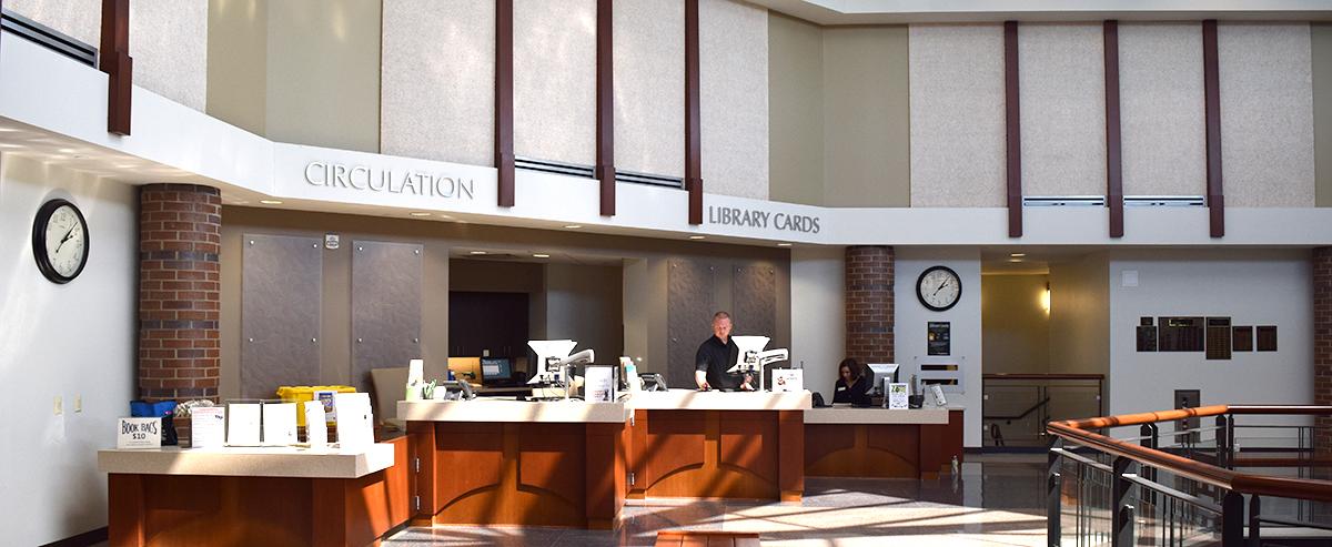 Circulation desk in the lobby of the Coralville Public Library.